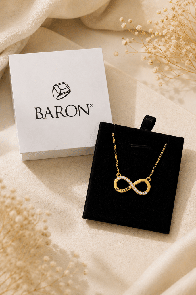 Gold plated infinity necklace with crystals, symbolizing bravery and support for cancer care
